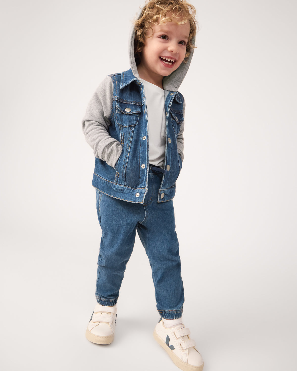 Boy wearing the Midwash Blue/Gray Denim Jacket with matching denim joggers