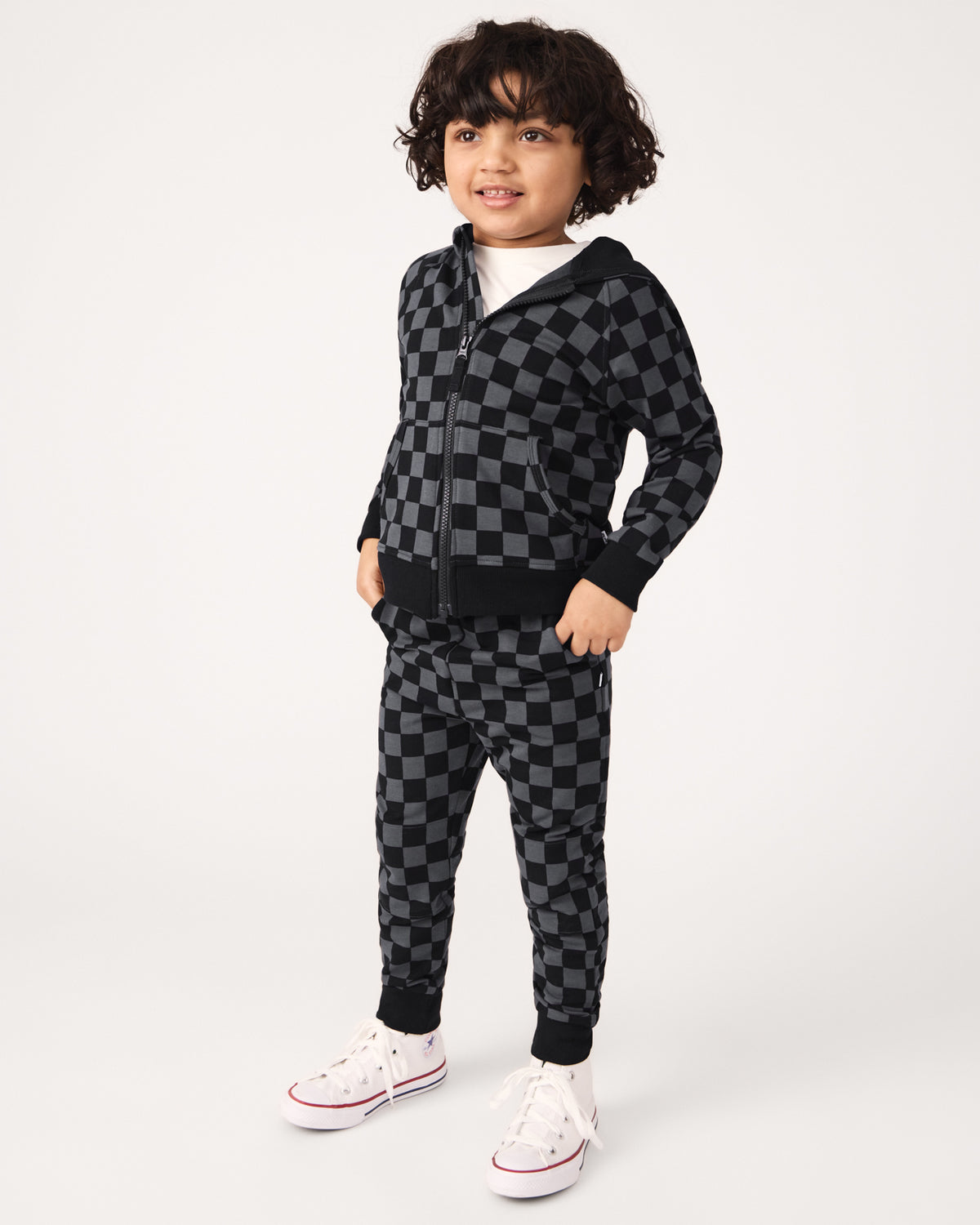Boy wearing the Monochrome Checks Jogger and Zip Hoodie