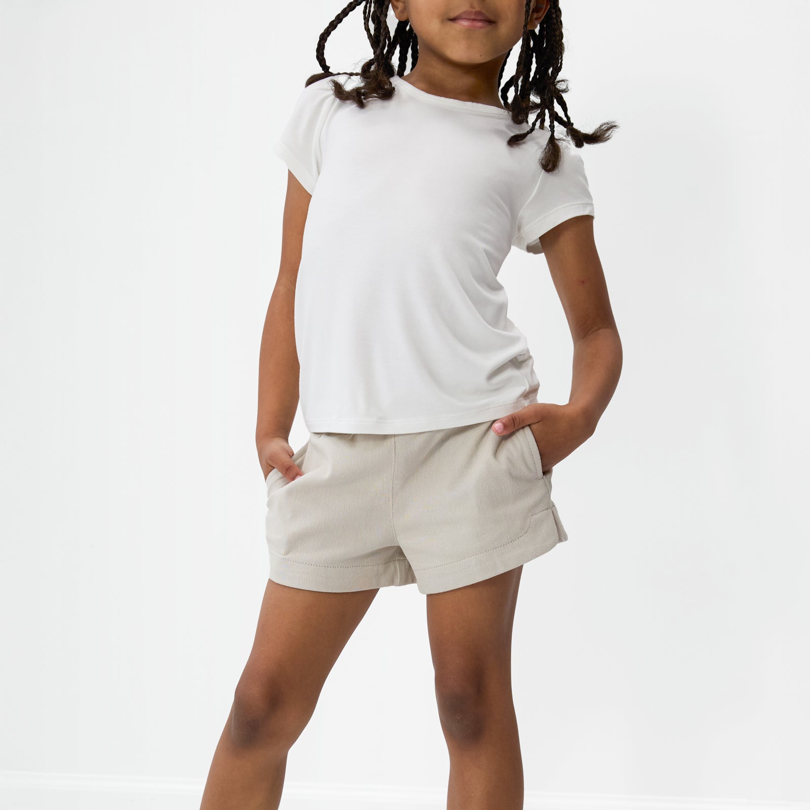 Posing child wearing the Sandstone Denim Shorts