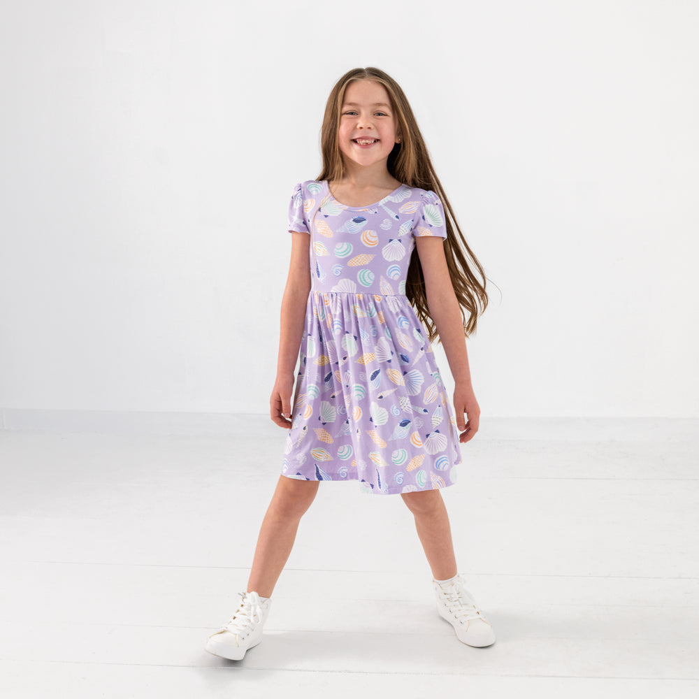 Standing child wearing the Sandy Treasures Skater Dress