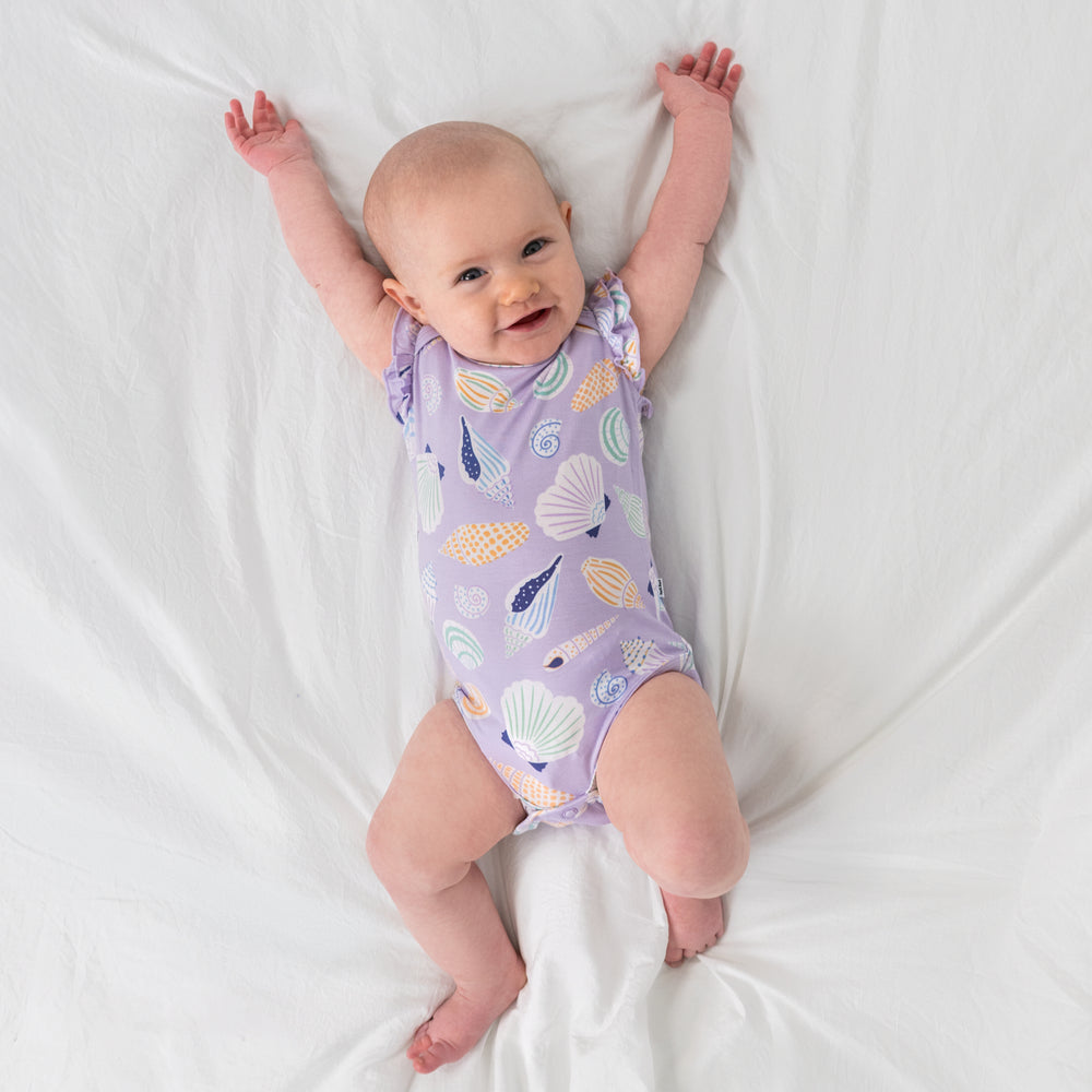 Aerial view of alternate child wearing the Sandy Treasures Flutter Bodysuit