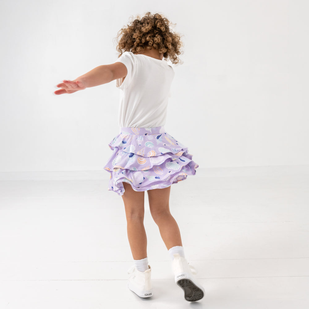 Child in motion wearing the Sandy Treasures Ruffle Skort