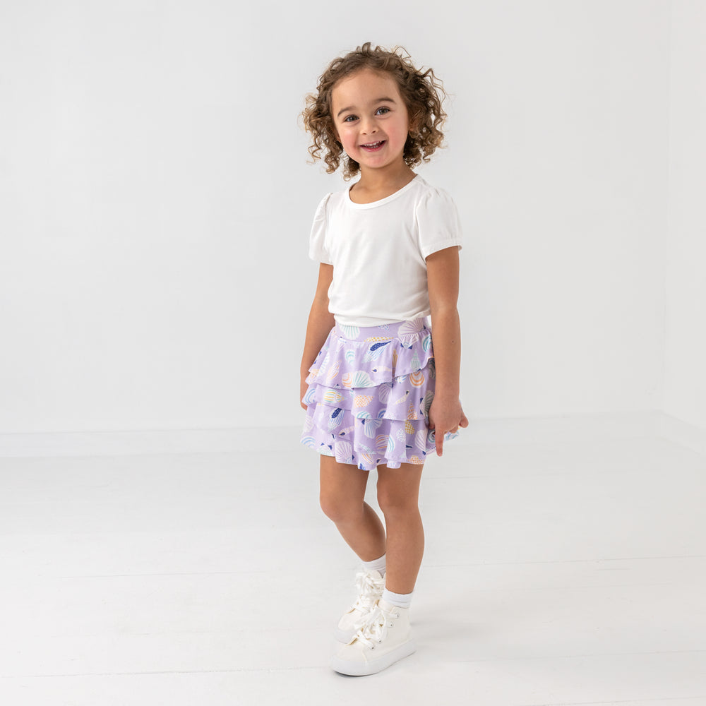 Walking child wearing the Sandy Treasures Ruffle Skort