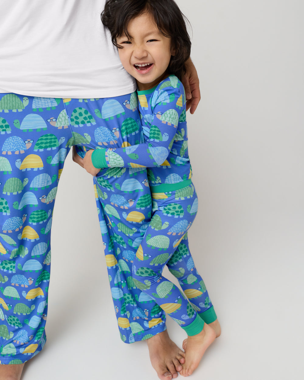 Father and son wearing matching Shell Parade Pajamas