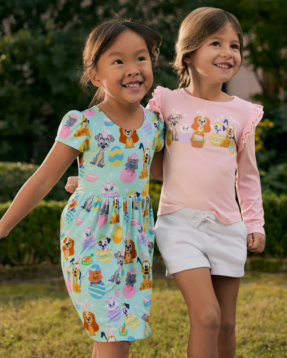 Two children wearing play styles from the Disney Peekaboo collection