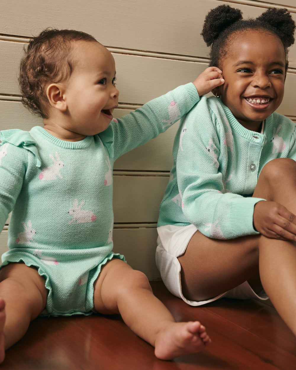 Two children wearing matching Blush Bunnies Sweater styles