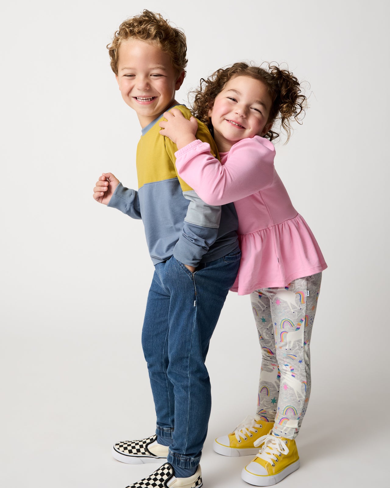 Two kids wearing styles from the Winter Play drop