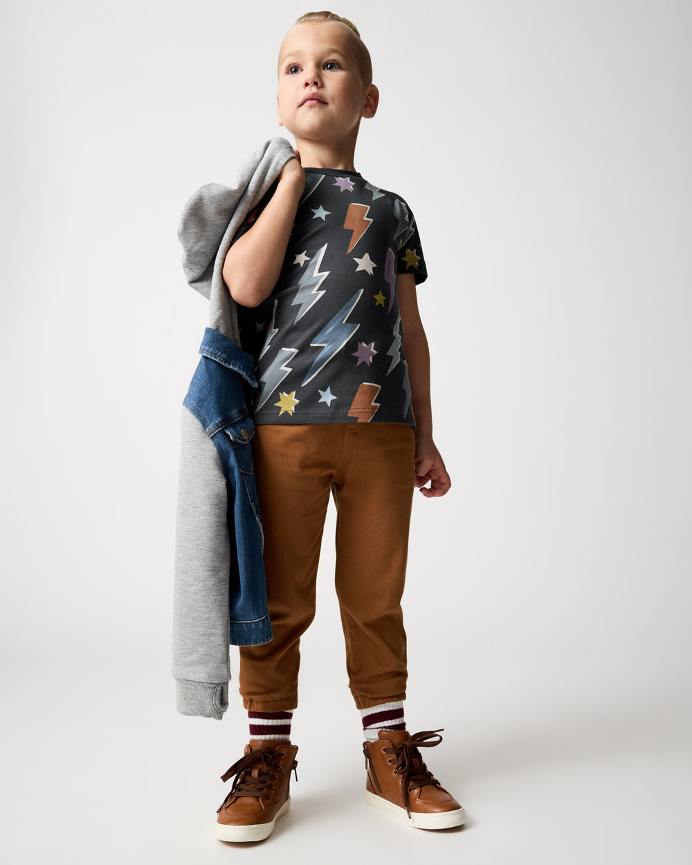 Boy wearing the Rich Toffee Denim Jogger styles with a relaxed tee
