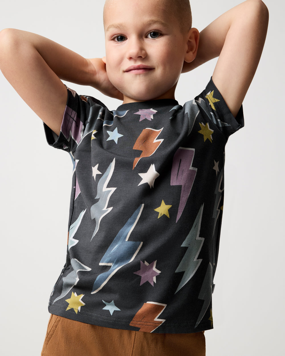 Posing child wearing the Rad Bolts Relaxed Tee