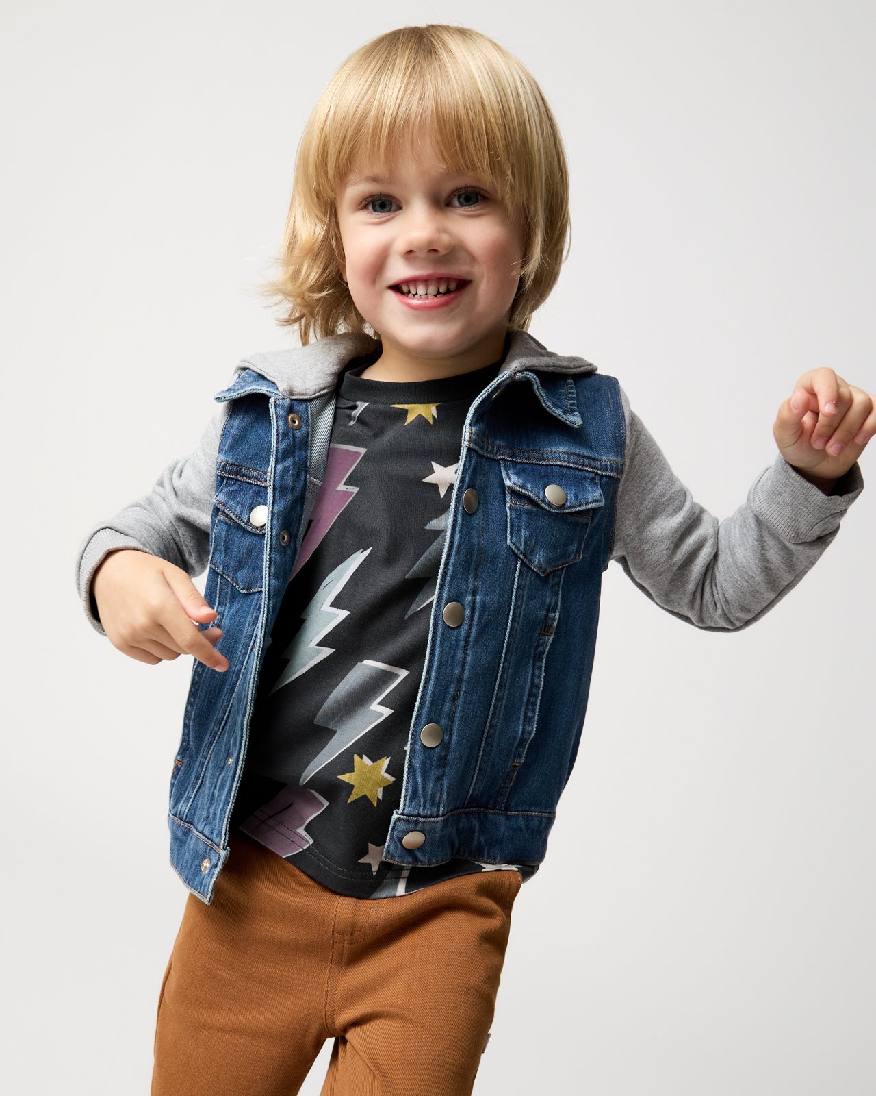 Child wearing the Rad Bolts Relaxed Tee layered under a trucker jacket