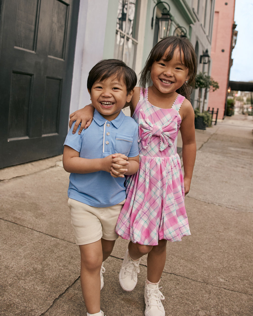 Two children wearing Play styles from the Easter collection