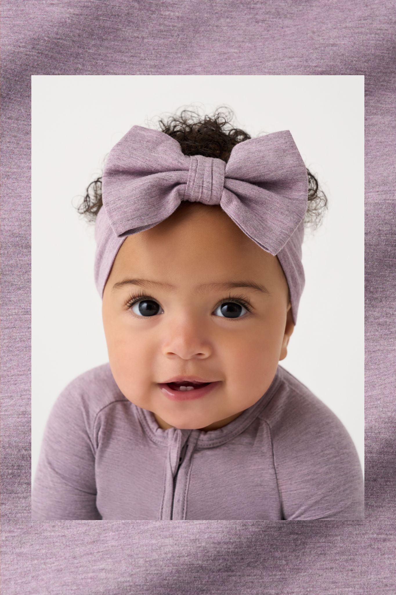 Close up of a child wearing a Heather Dusty Lavender Zippy and Luxe Bow Headband