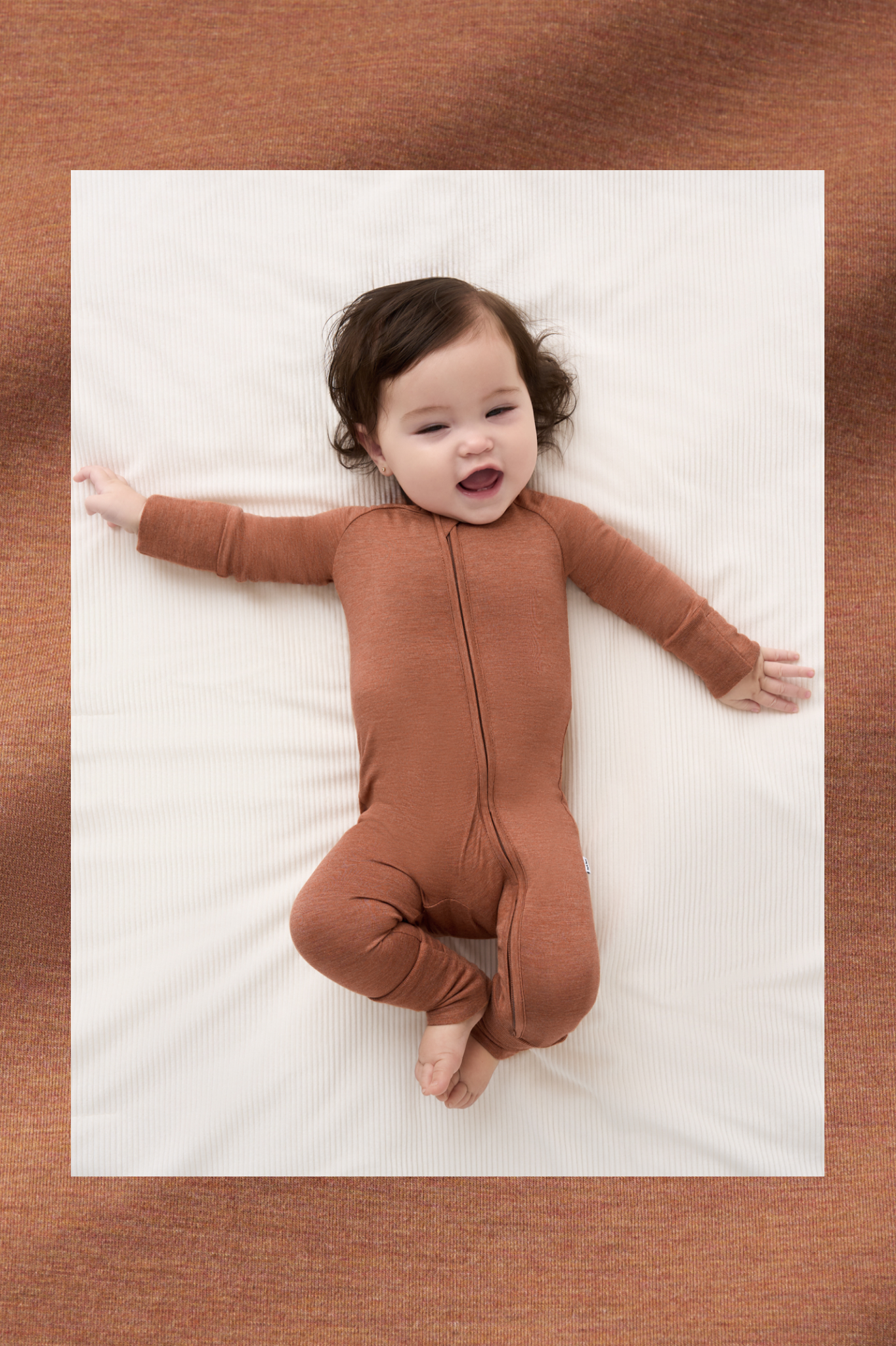 Infant wearing a Heather Spice Zippy