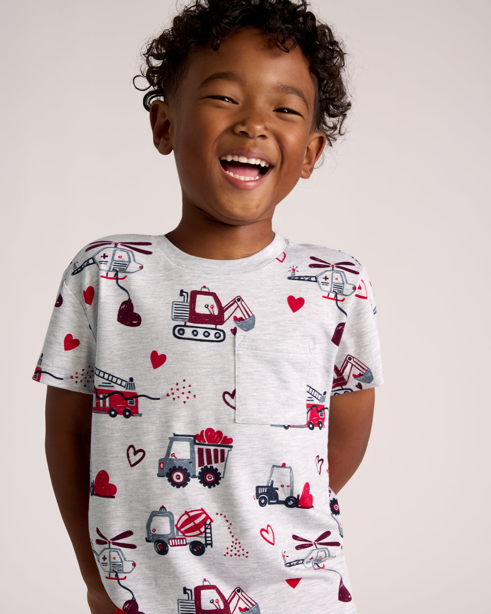 Boy wearing the Loads of Love Relaxed Pocket Tee