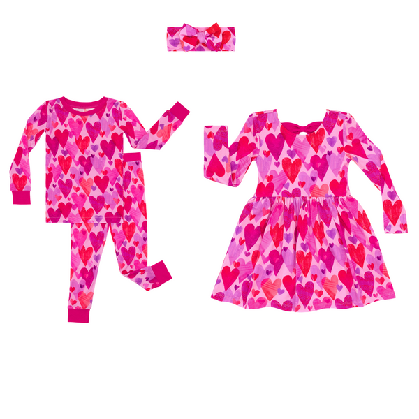 flat lay composite of a pink hearts & crafts two-piece pajama set, bow back skater dress, and luxe bow headband