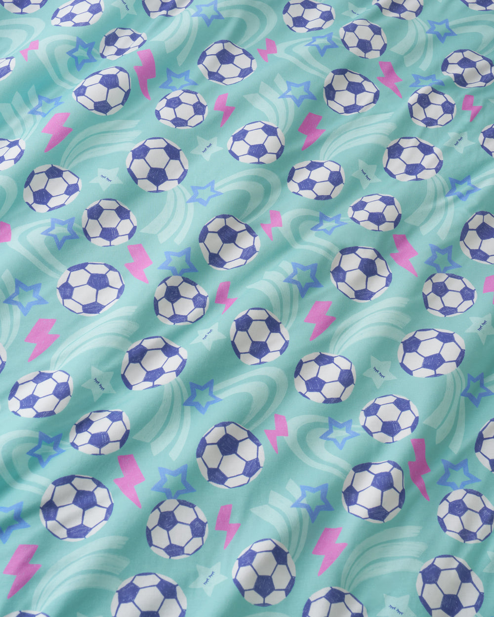 Close up of the Aqua Soccer Stars fabric