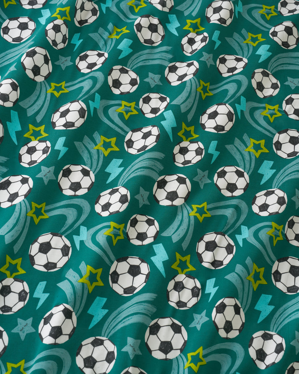 Close up of the Green Soccer Stars fabric