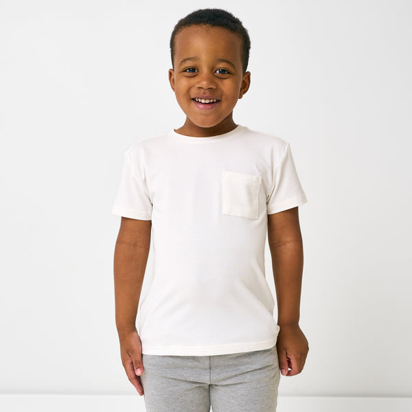 Boy wearing the Soft White Short Sleeve Relaxed Pocket Tee