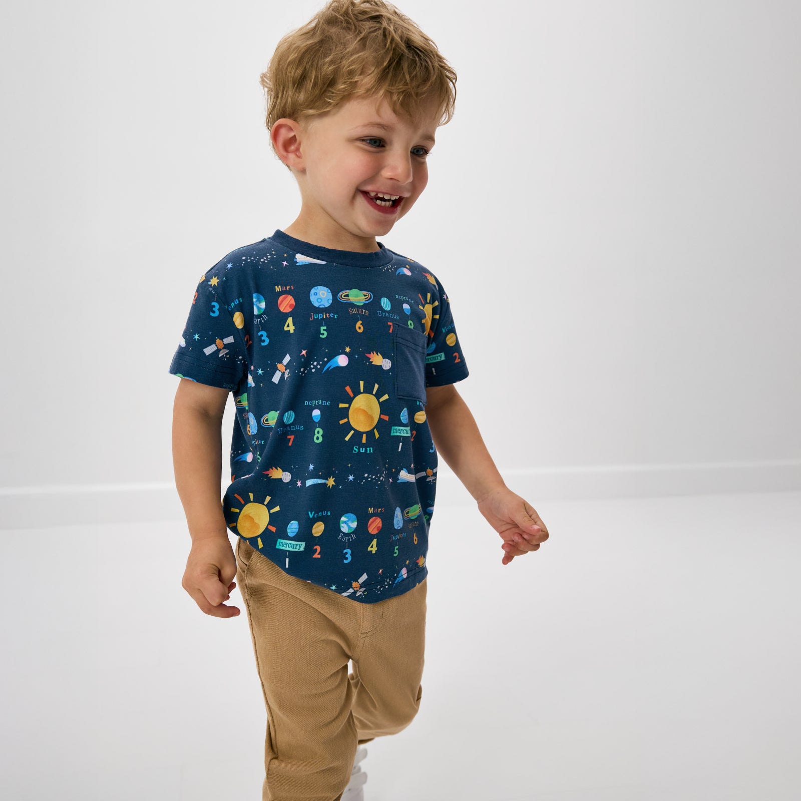 Boy wearing the Solar Explorers Relaxed Pocket Tee with khaki boys pants