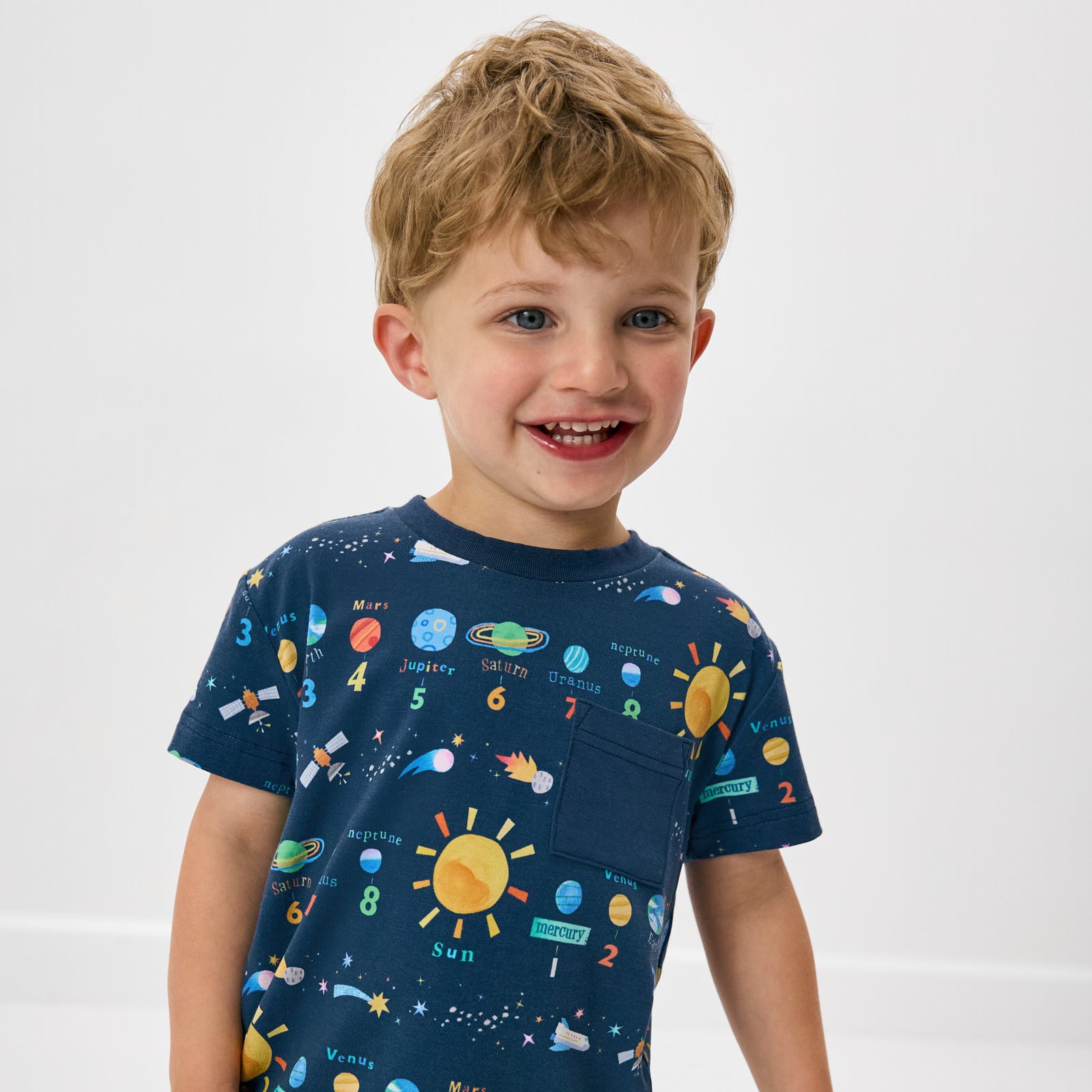 Close up of boy wearing the Solar Explorers Relaxed Pocket Tee