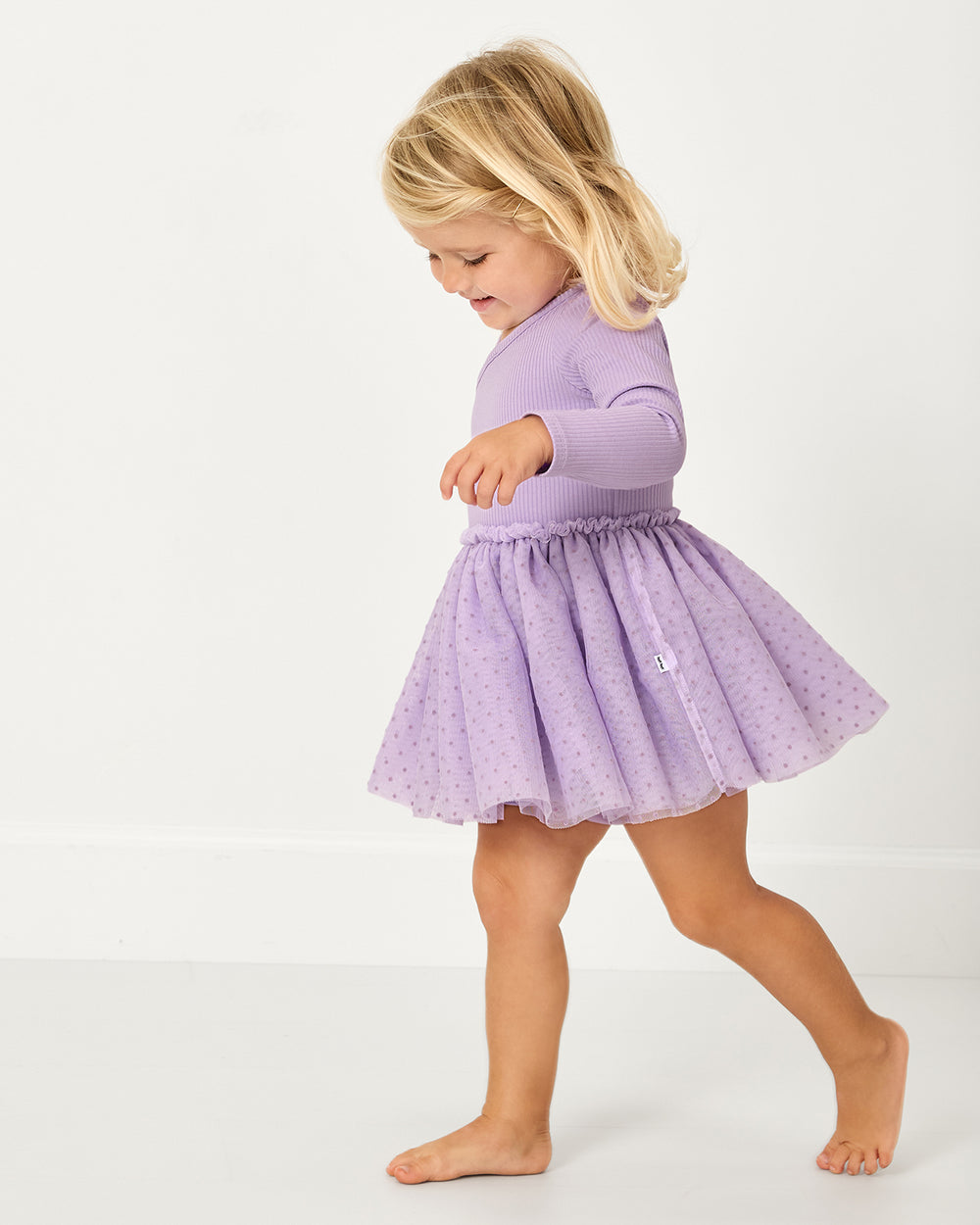 Walking toddler wearing the Orchid Bloom Layered Tulle Dress with Bloomer