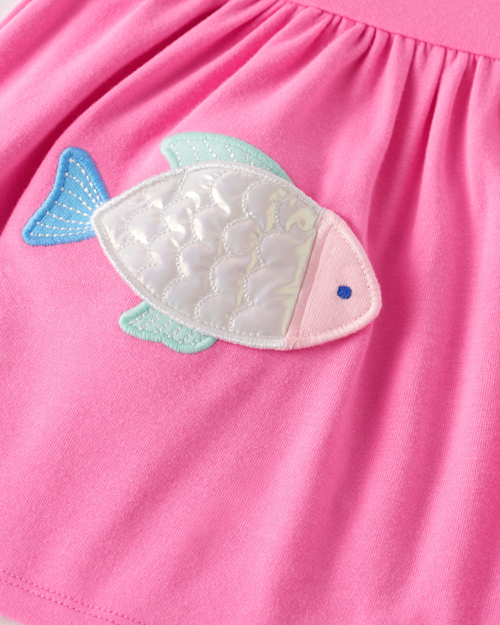 Close up of the fish detail on the Sparkling Scales Empire Tunic Top with Bloomer