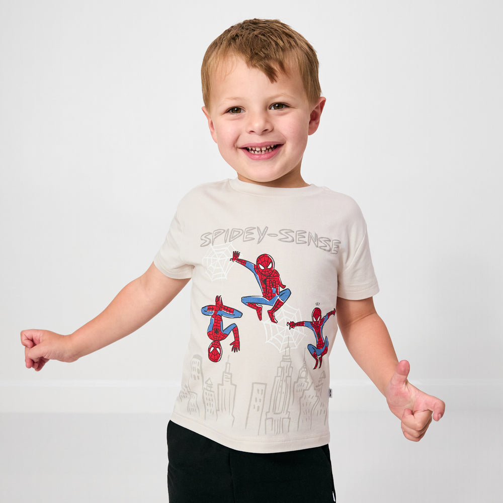 Standing child wearing the Spidey Sense Relaxed Tee