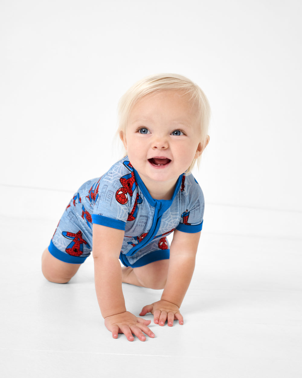 Crawling baby wearing the Spidey Sense Shorty Zippy