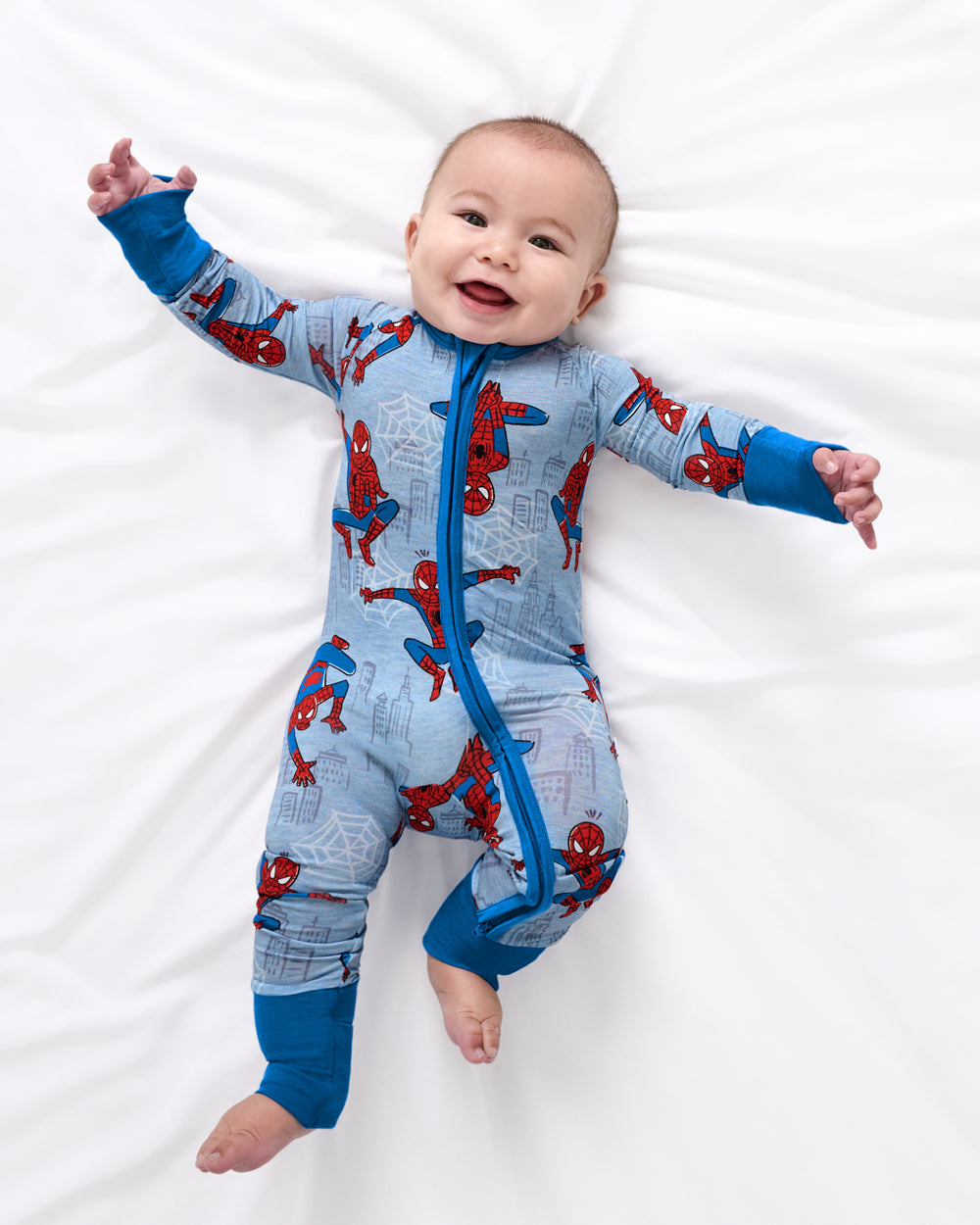 Aerial view of baby wearing the Spidey Sense Zippy