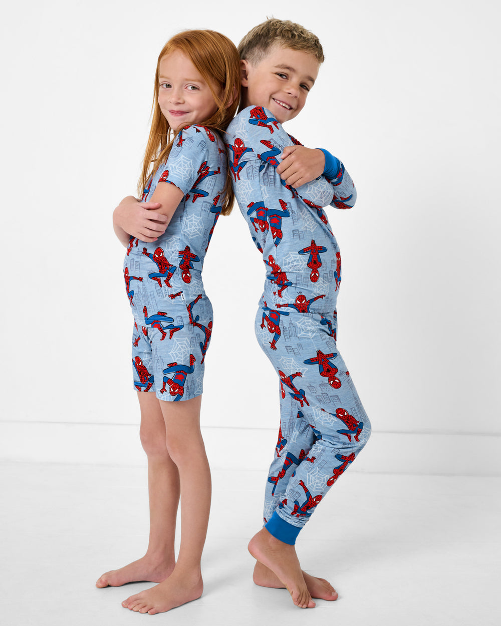 Two posing kids wearing Spidey Sense Two-Piece Pajama Sets