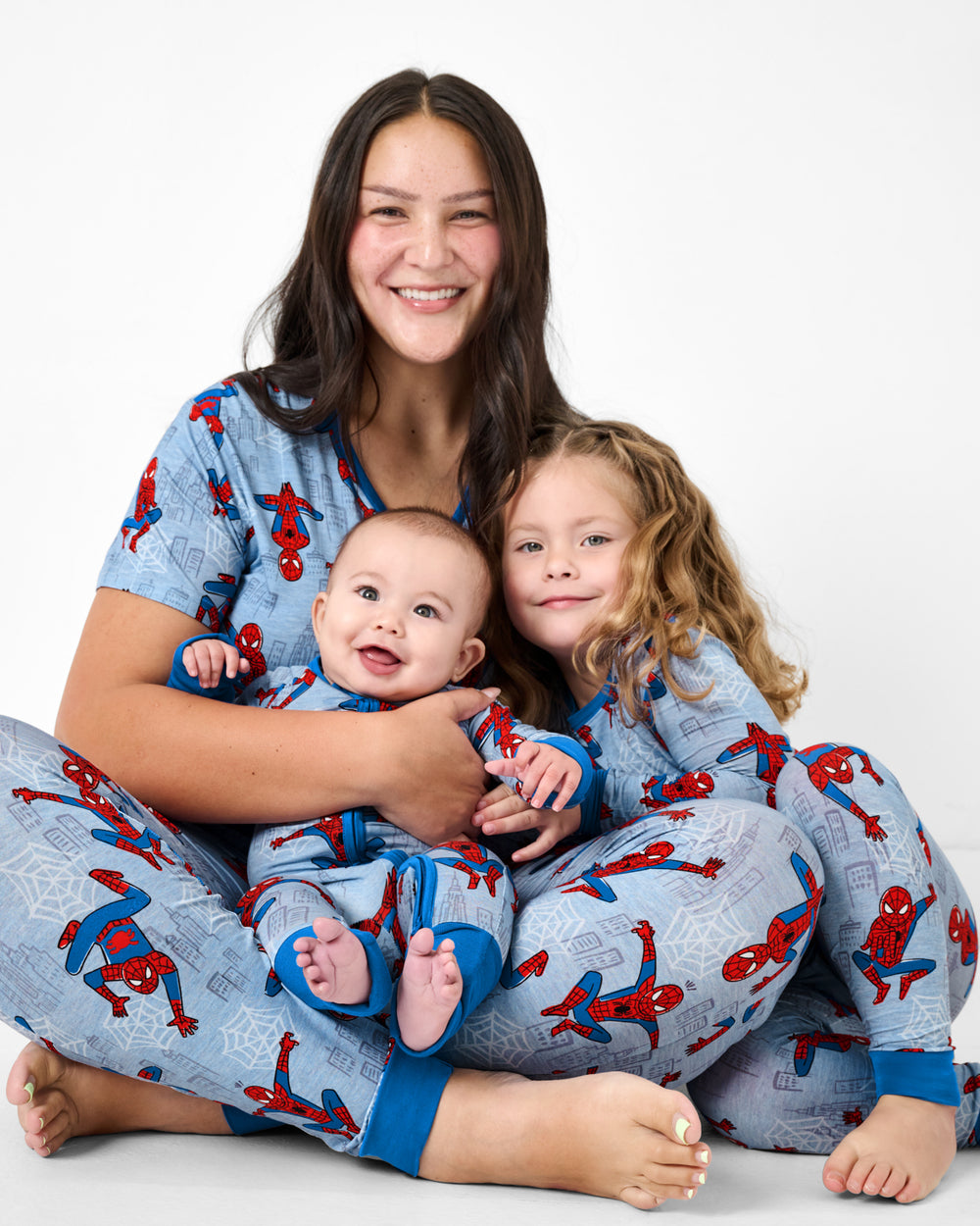 Mother and two children wearing matching Spidey Sense bamboo PJs