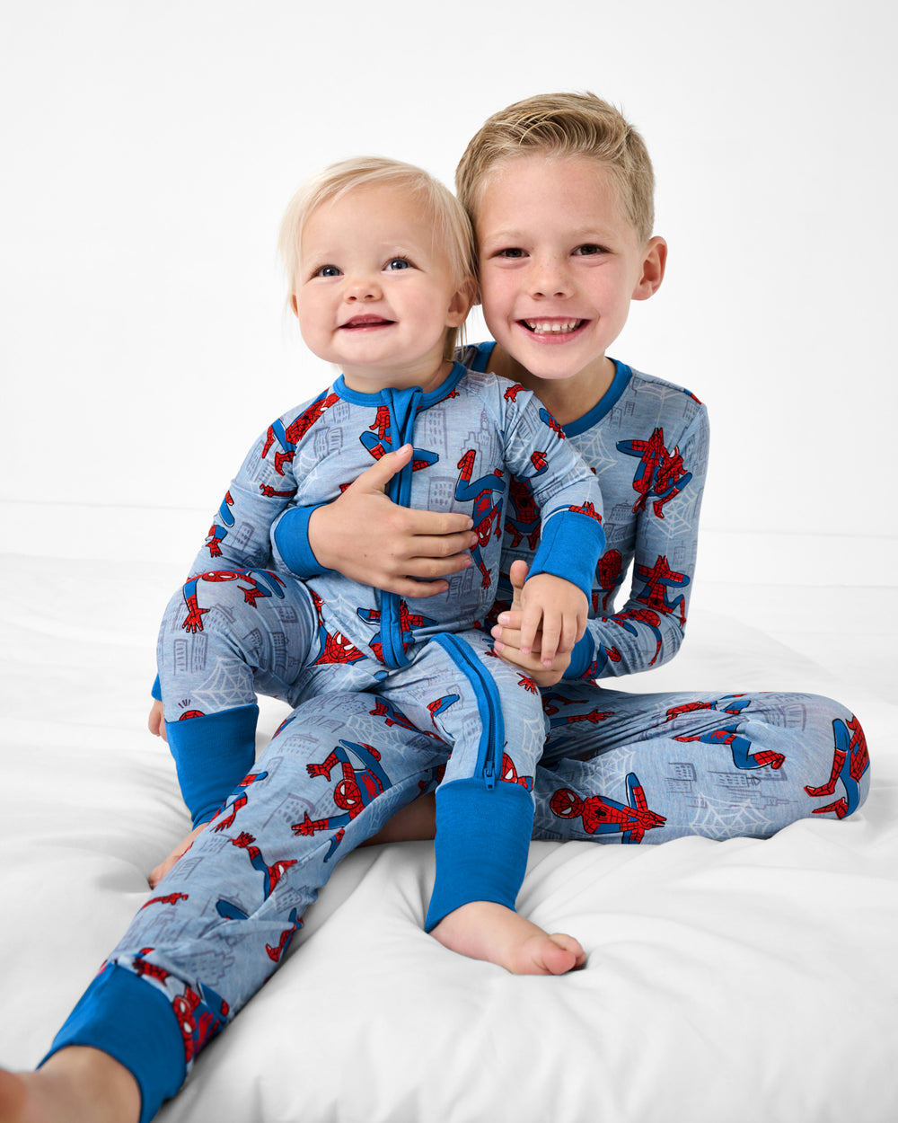 Two boys wearing matching Spidey Sense PJs