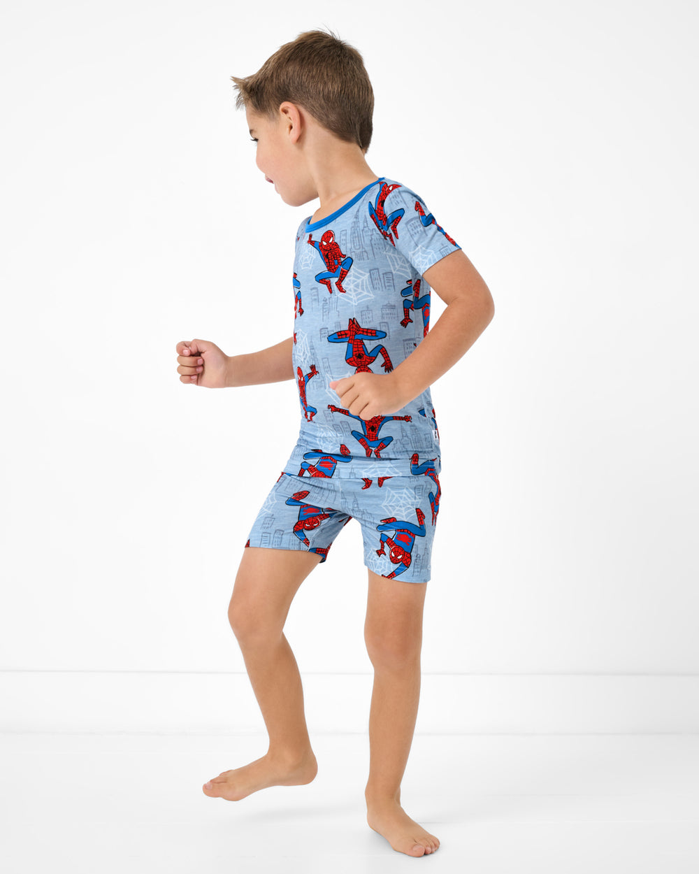 Standing boy wearing the Spidey Sense Two-Piece Short Sleeve & Shorts Pajama Set