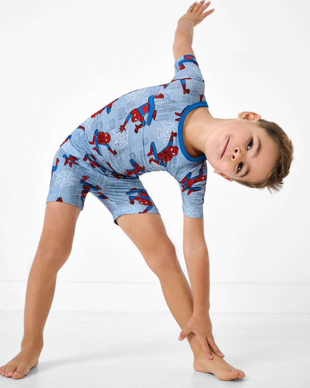 Posing boy wearing the Spidey Sense Two-Piece Short Sleeve & Shorts Pajama Set