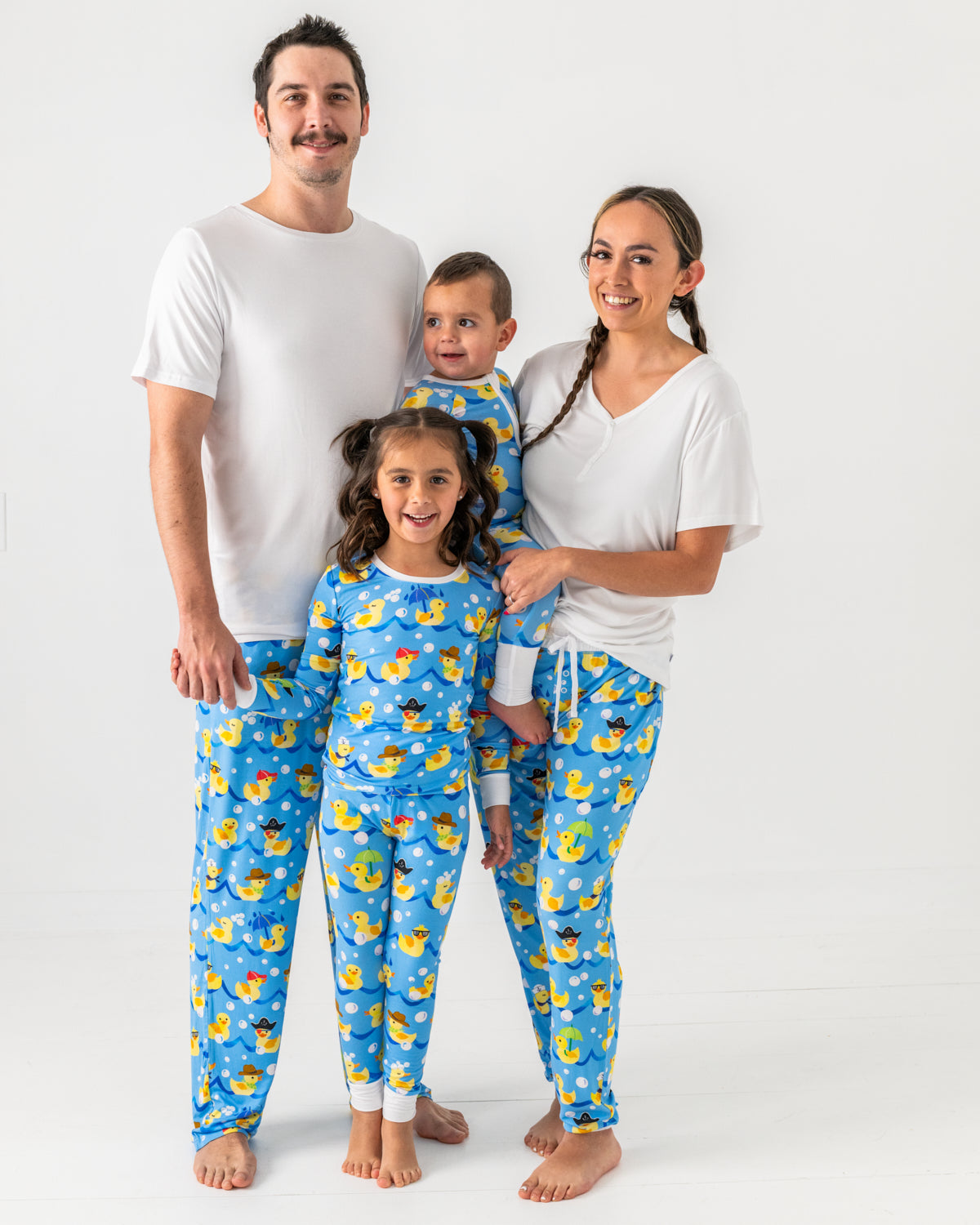 Family of four wearing matching Splish Splash pajamas