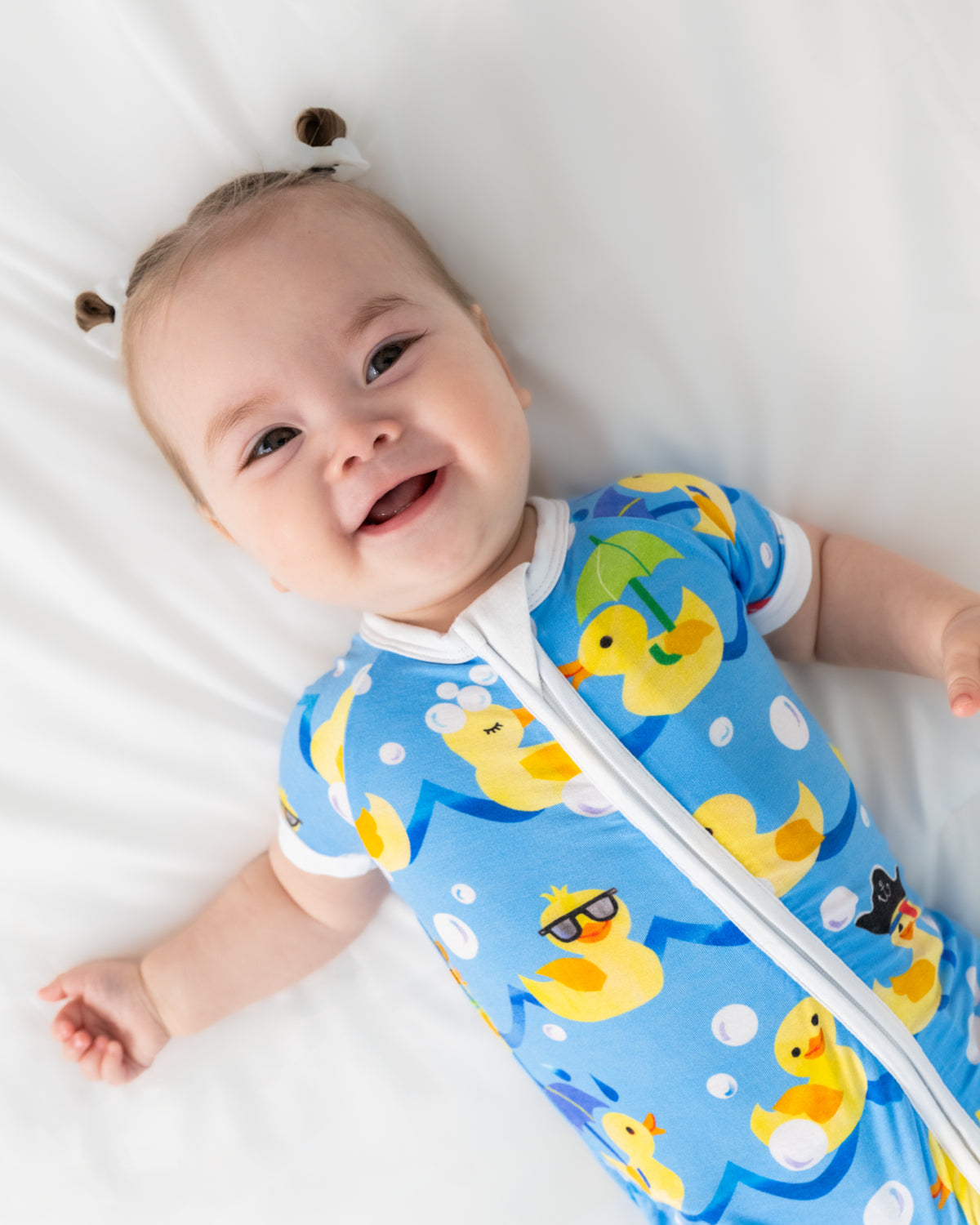 Close up of baby wearing the Splish Splash Shorty Zippy