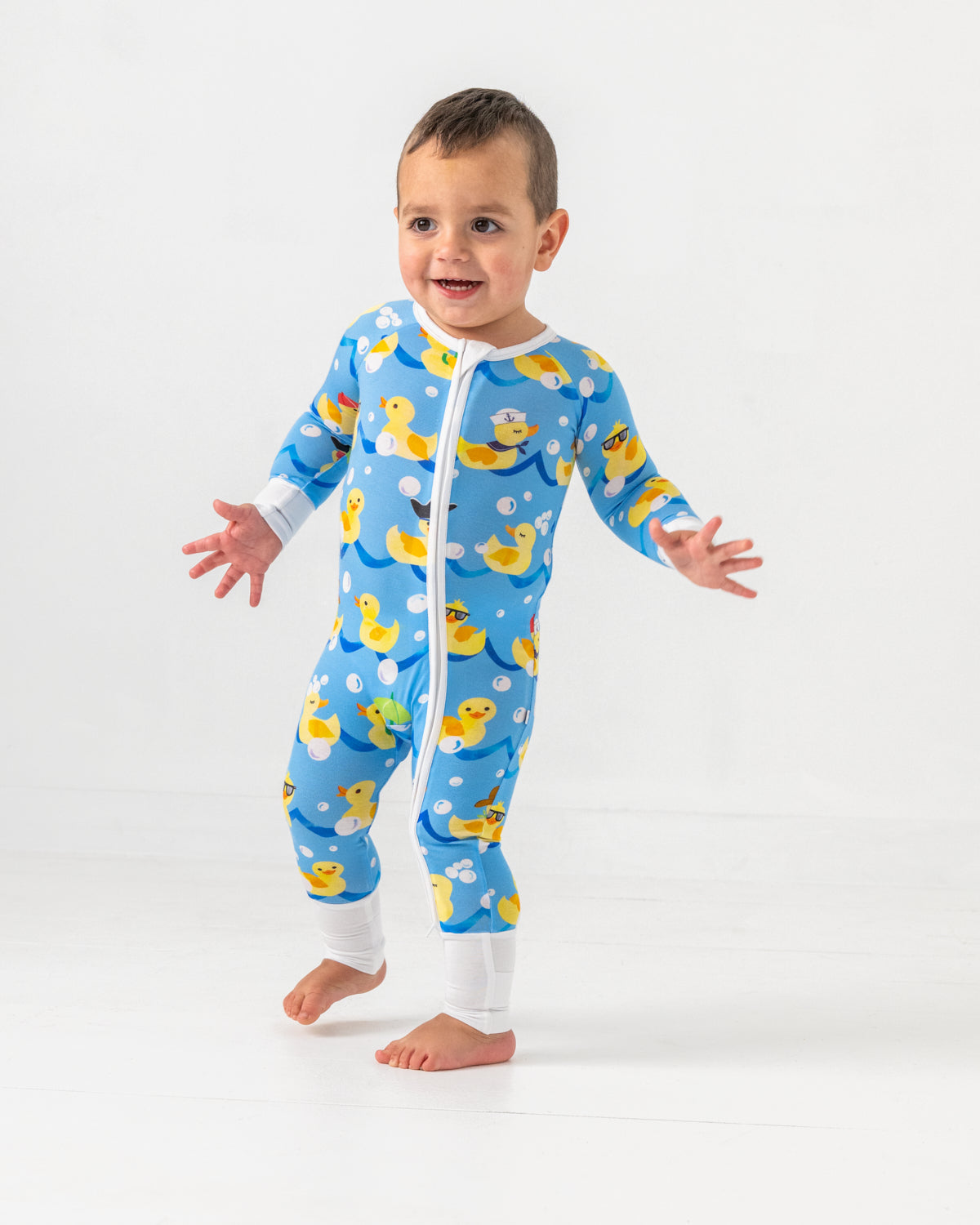 Walking toddler wearing the Splish Splash Zippy