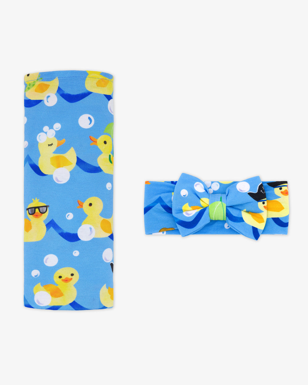 Flat lay of the Splish Splash Swaddle & Luxe Bow Headband Set
