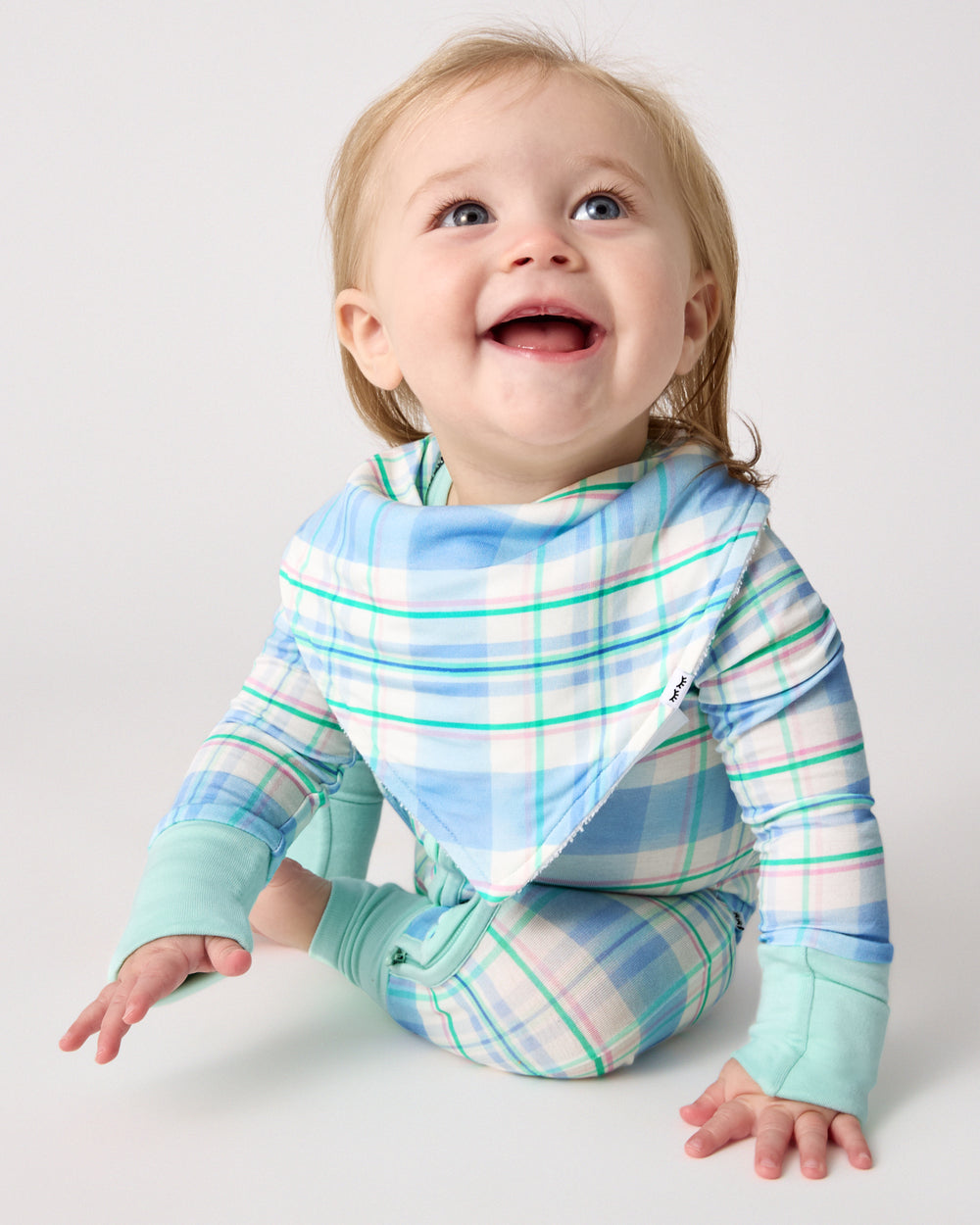 Baby wearing the Springtime Plaid Bandana Bib