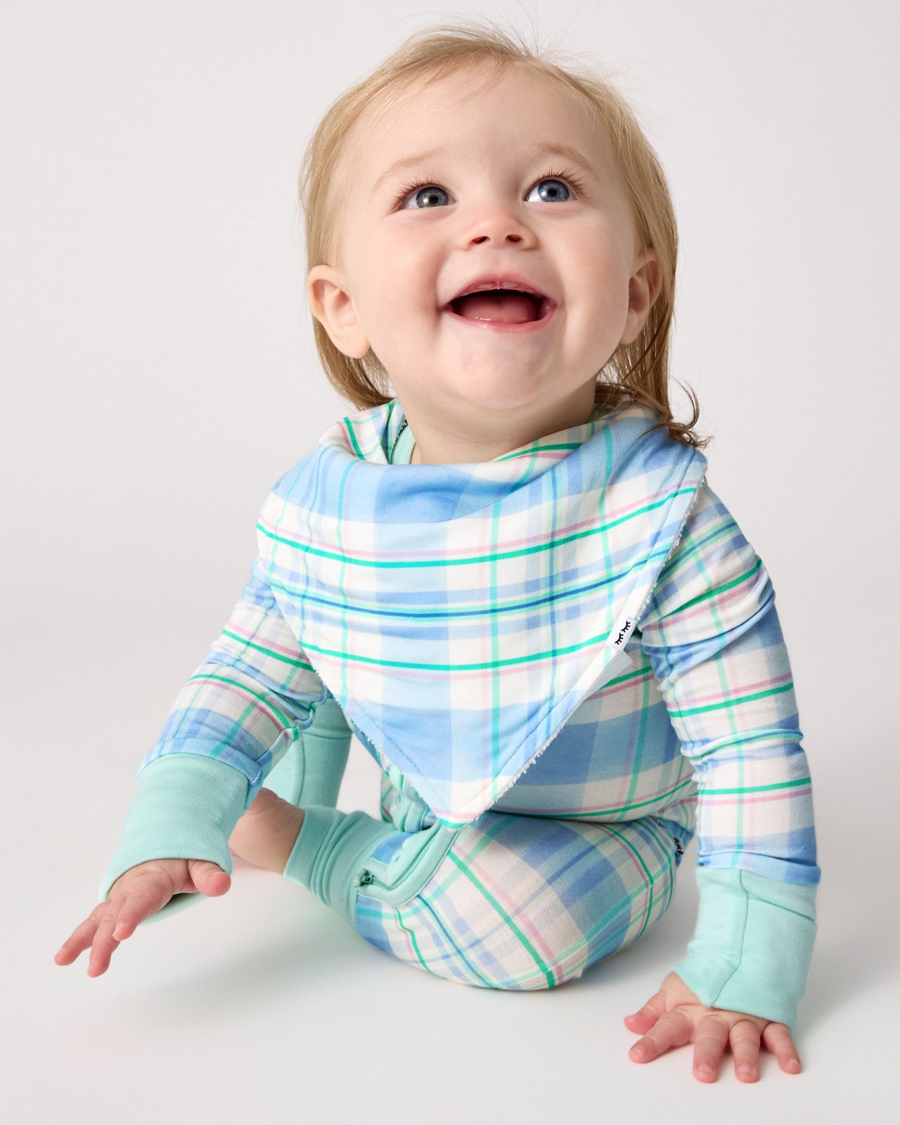 Baby wearing the Springtime Plaid Bandana Bib