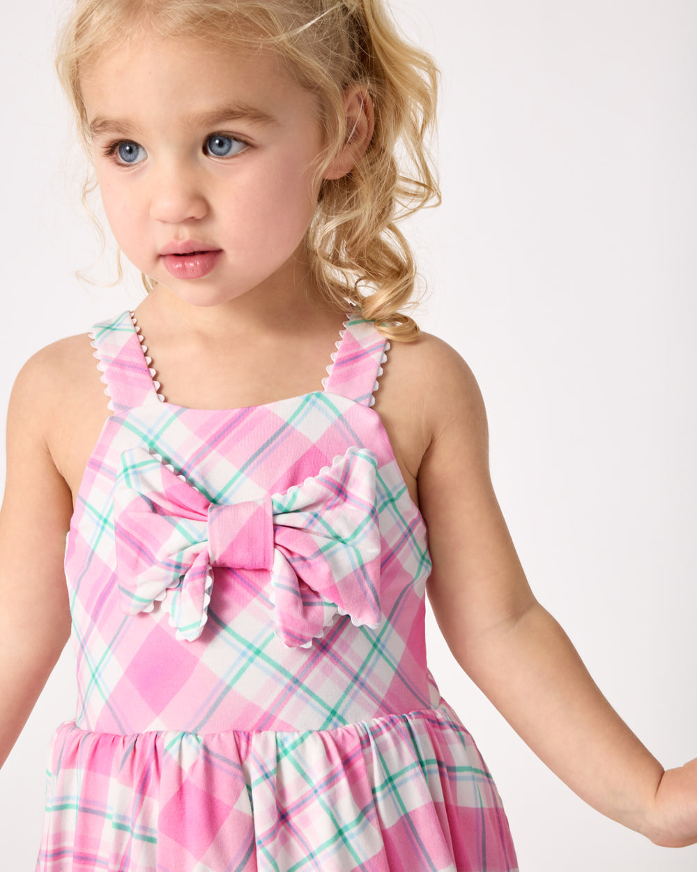 Close up of the bow detail on the Springtime Plaid Bow Bubble Dress
