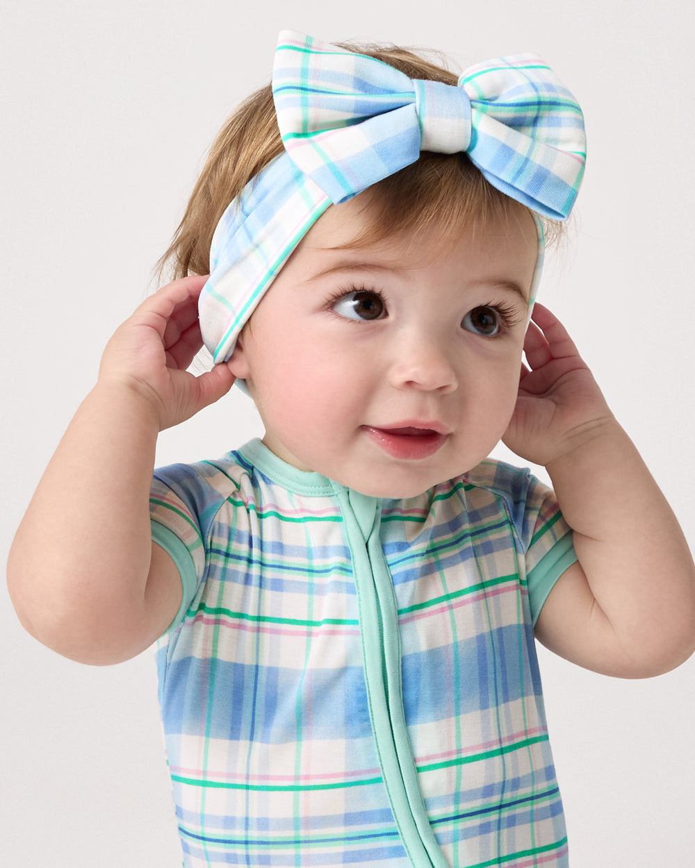 Baby wearing the Springtime Plaid Luxe Bow Headband