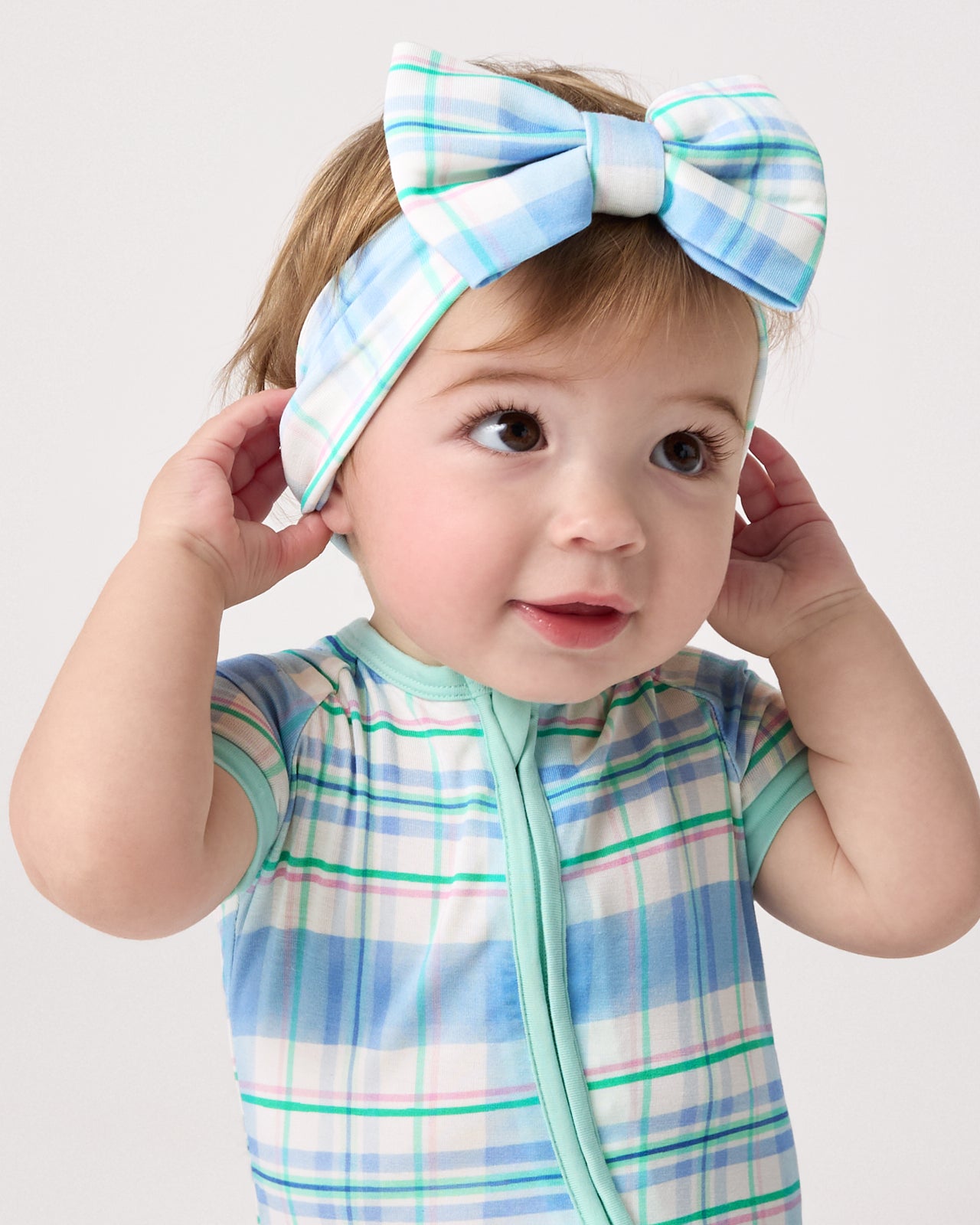 Baby wearing the Springtime Plaid Luxe Bow Headband