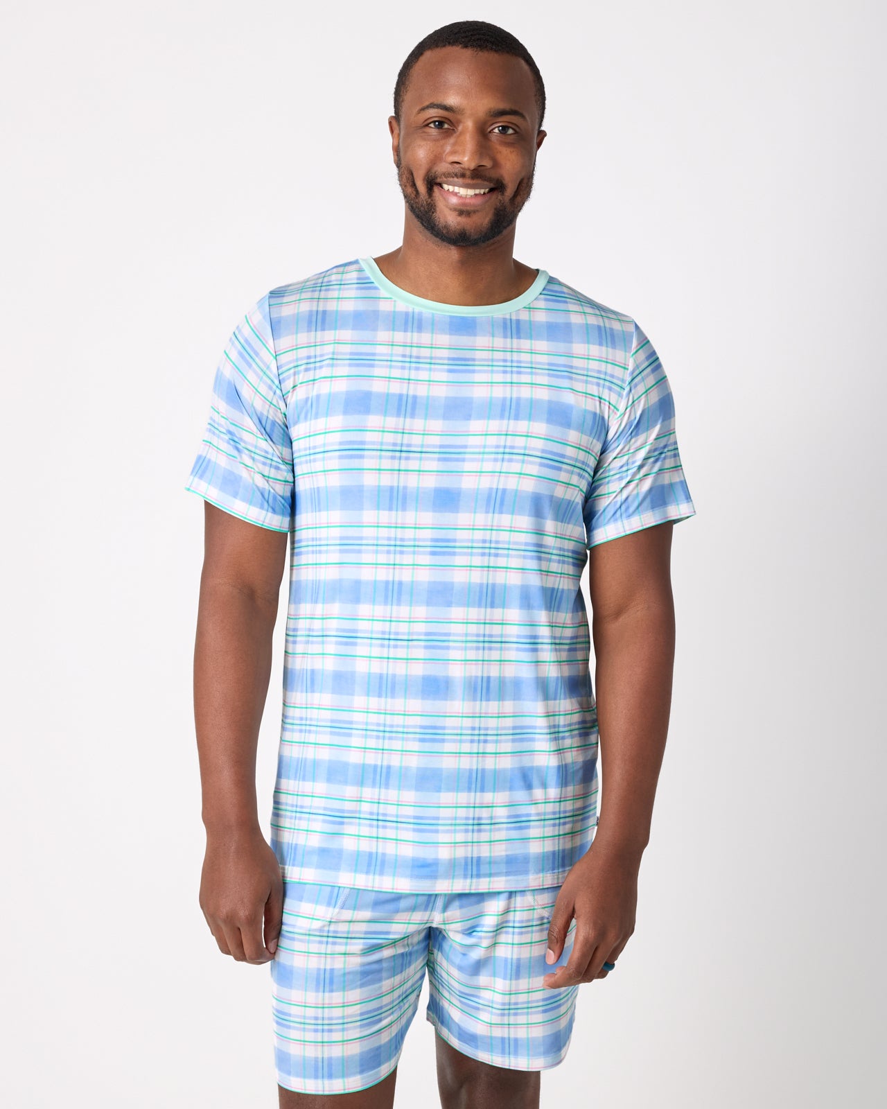 Man wearing the Springtime Plaid Men's Short Sleeve Pajama Top and Shorts
