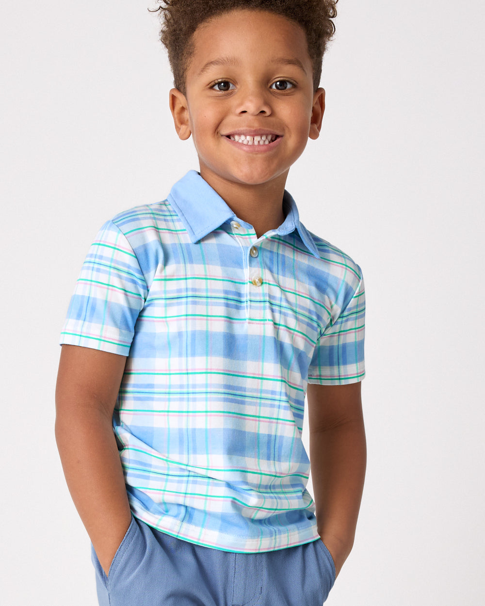 Close up of boy wearing the Springtime Plaid Polo Shirt