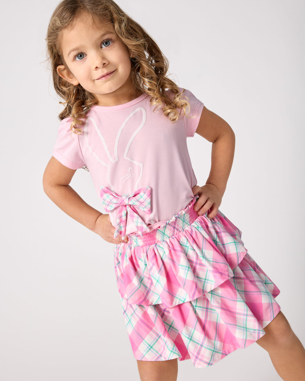 Child wearing the Springtime Plaid Tiered Skort with the Flocked Bunny Puff Sleeve Tee