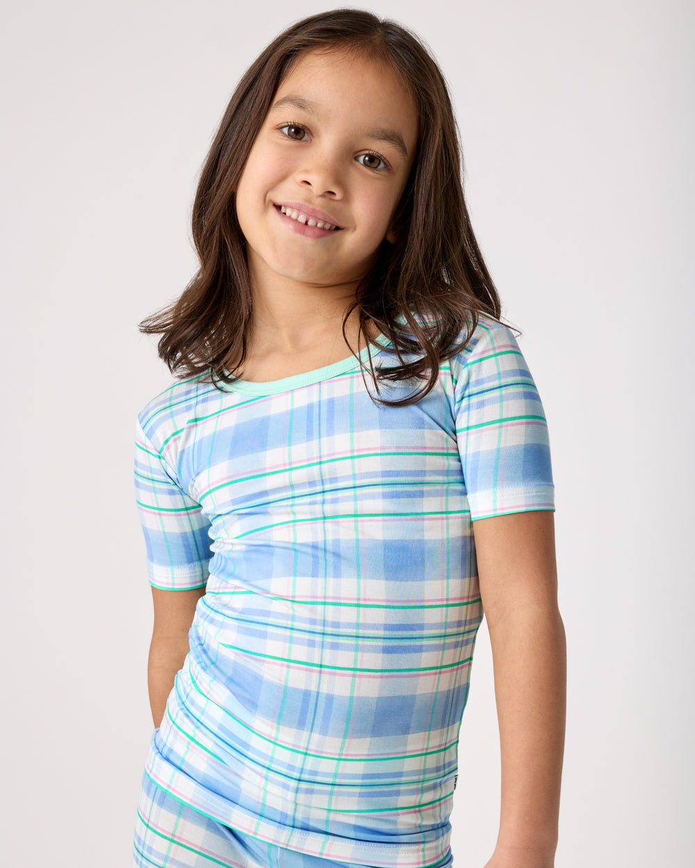 Close up of girl wearing the Springtime Plaid Two-Piece Short Sleeve Pajama Set