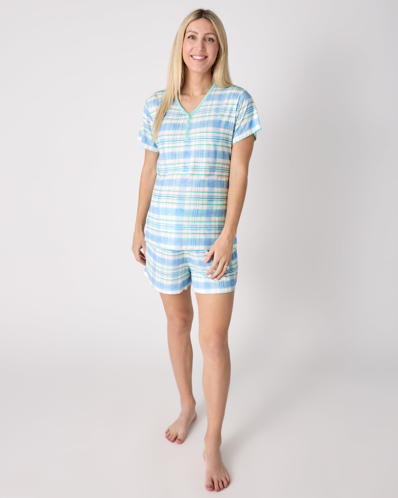 Woman wearing the Springtime Plaid Women's Short Sleeve Pajama Top and Shorts