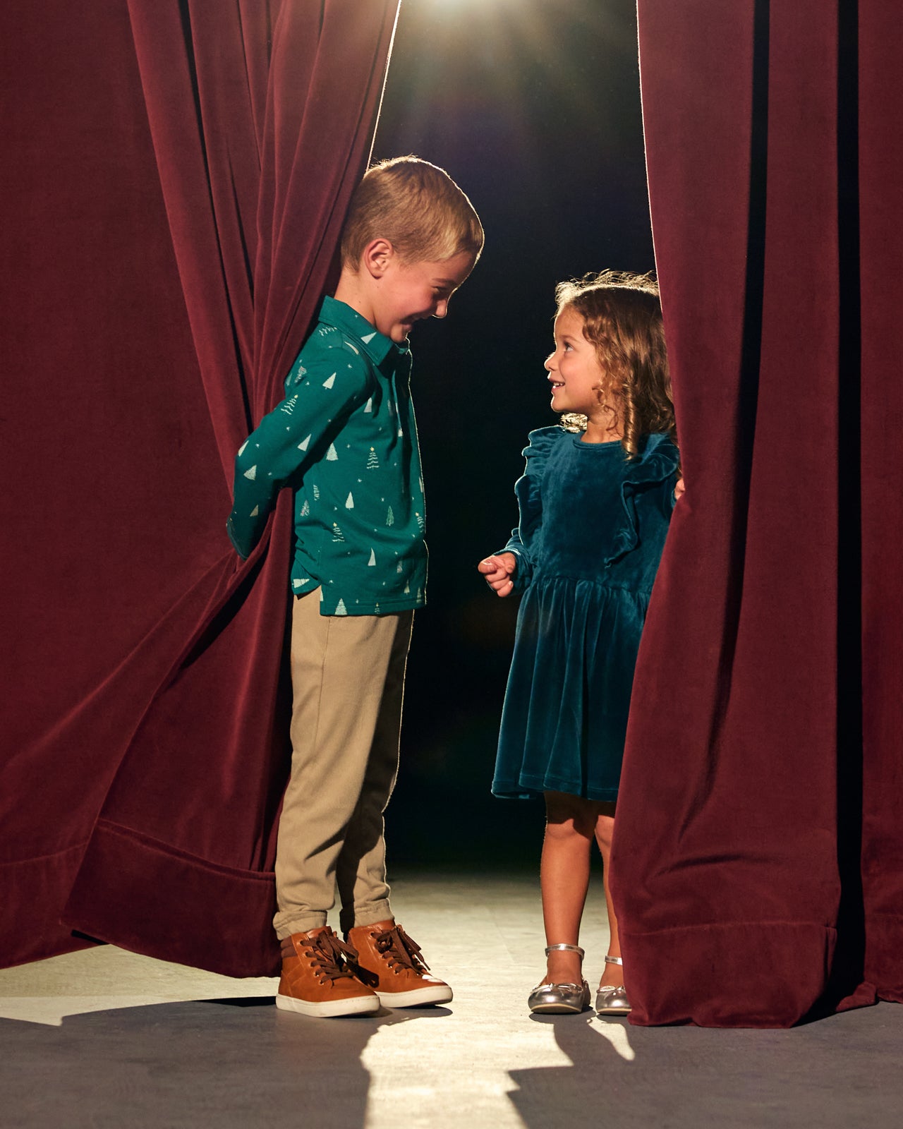Two children wearing Holiday Play styles