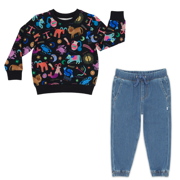 flat lay composite of a star signs crewneck sweatshirt and midwash blue denim jogger